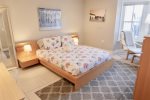 Queen sized bed in the primary bedroom located at front of property 